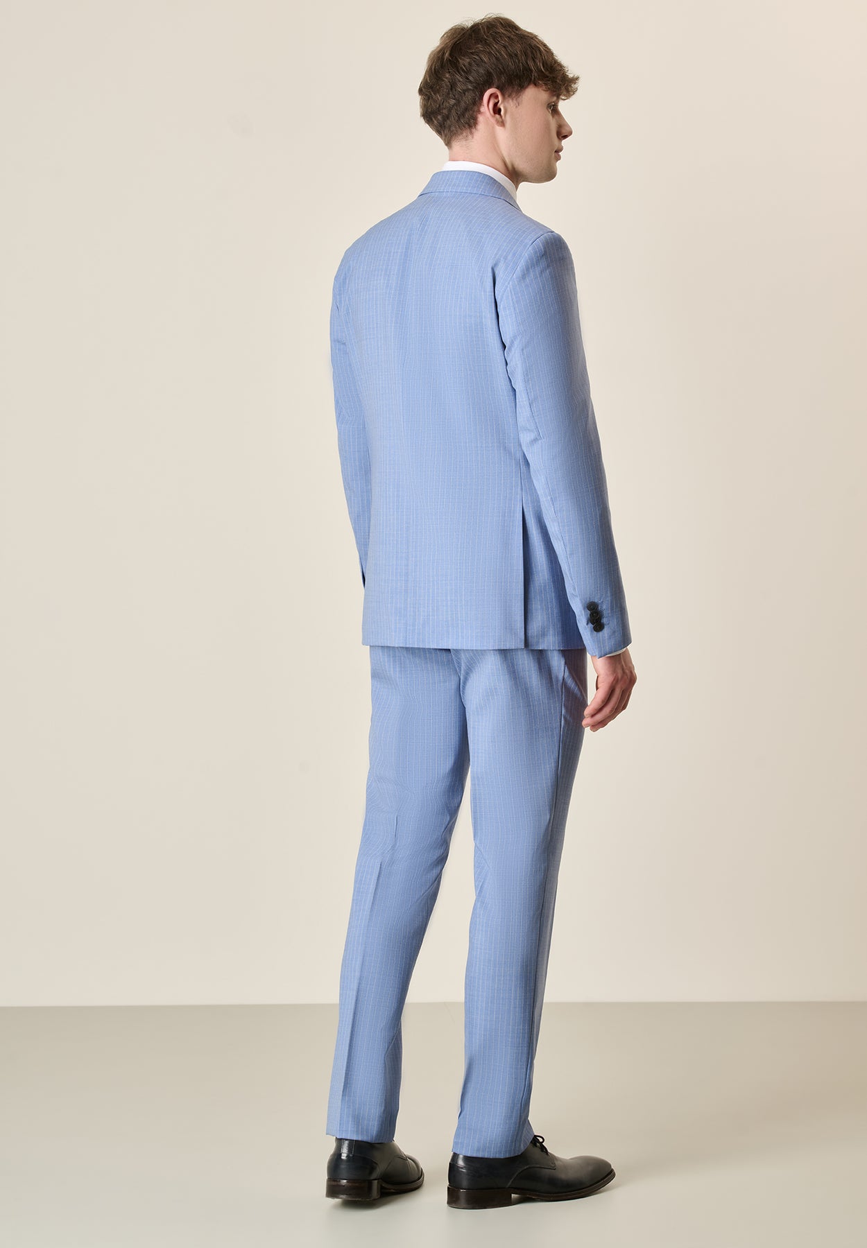 Custom fit light blue pinstriped virgin wool suit
