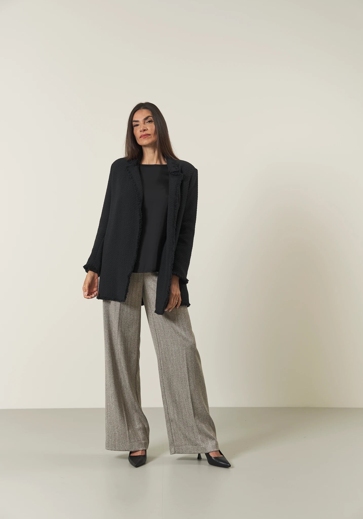 Long black jacket with braid and fringes open
