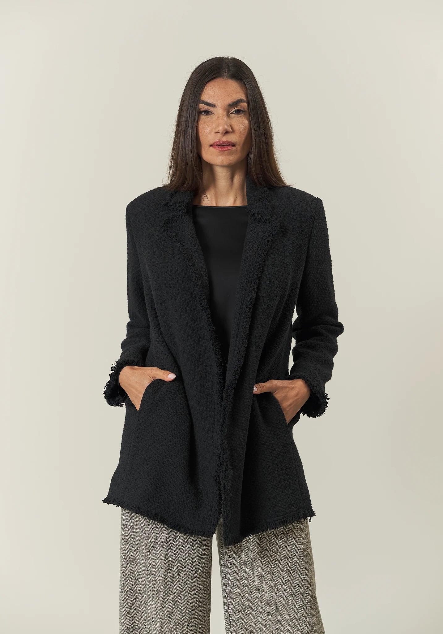 Long black jacket with braid and fringes open