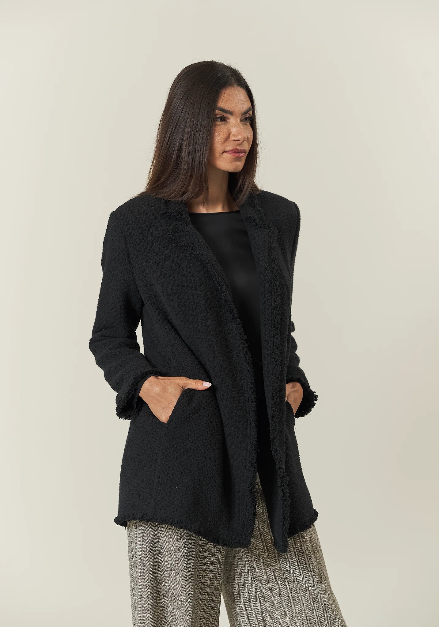 Long black jacket with braid and fringes open