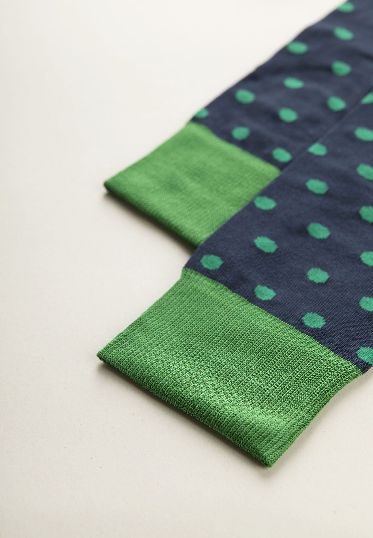 Navy blue sock with green polka dots stretch cotton