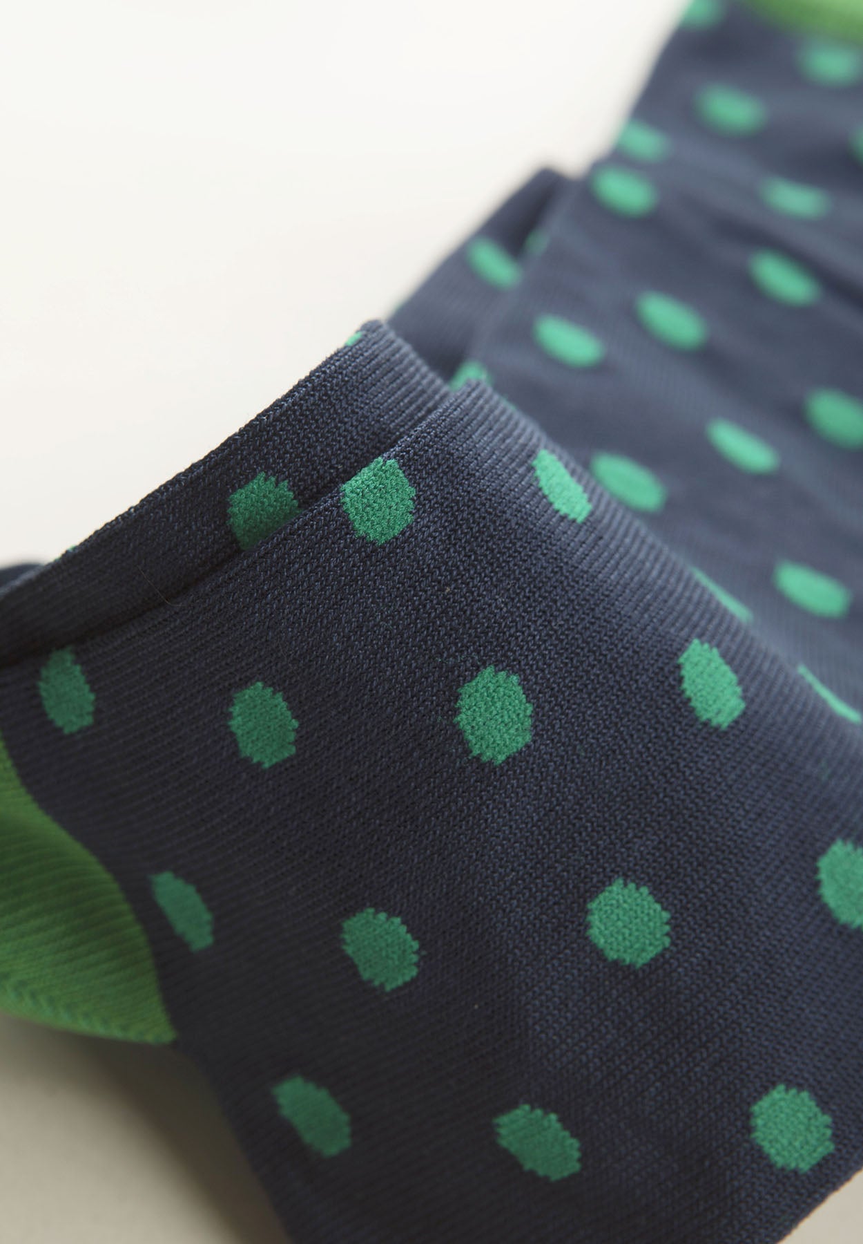 Navy blue sock with green polka dots stretch cotton