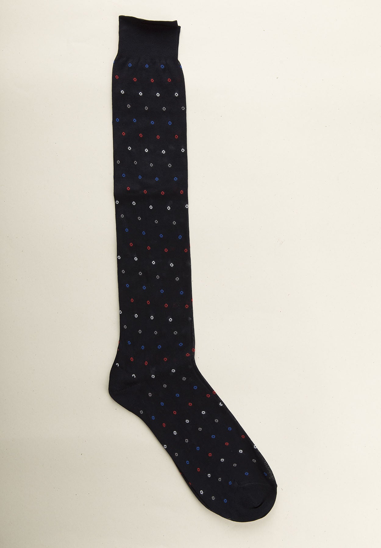 Dark blue sock with micro polka dot pattern and Scottish thread