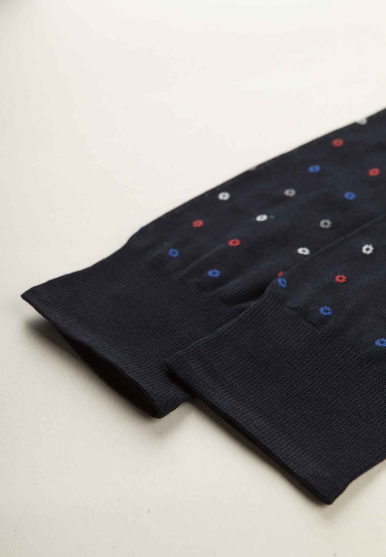 Dark blue sock with micro polka dot pattern and Scottish thread