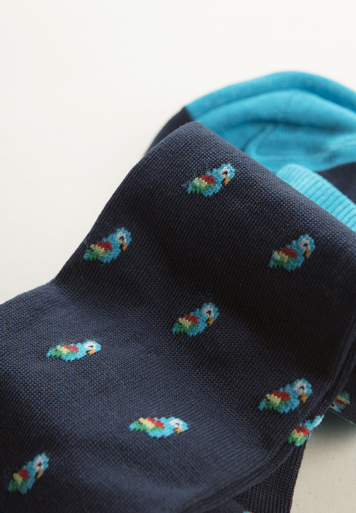 Navy blue sock with parrot pattern and stretch cotton