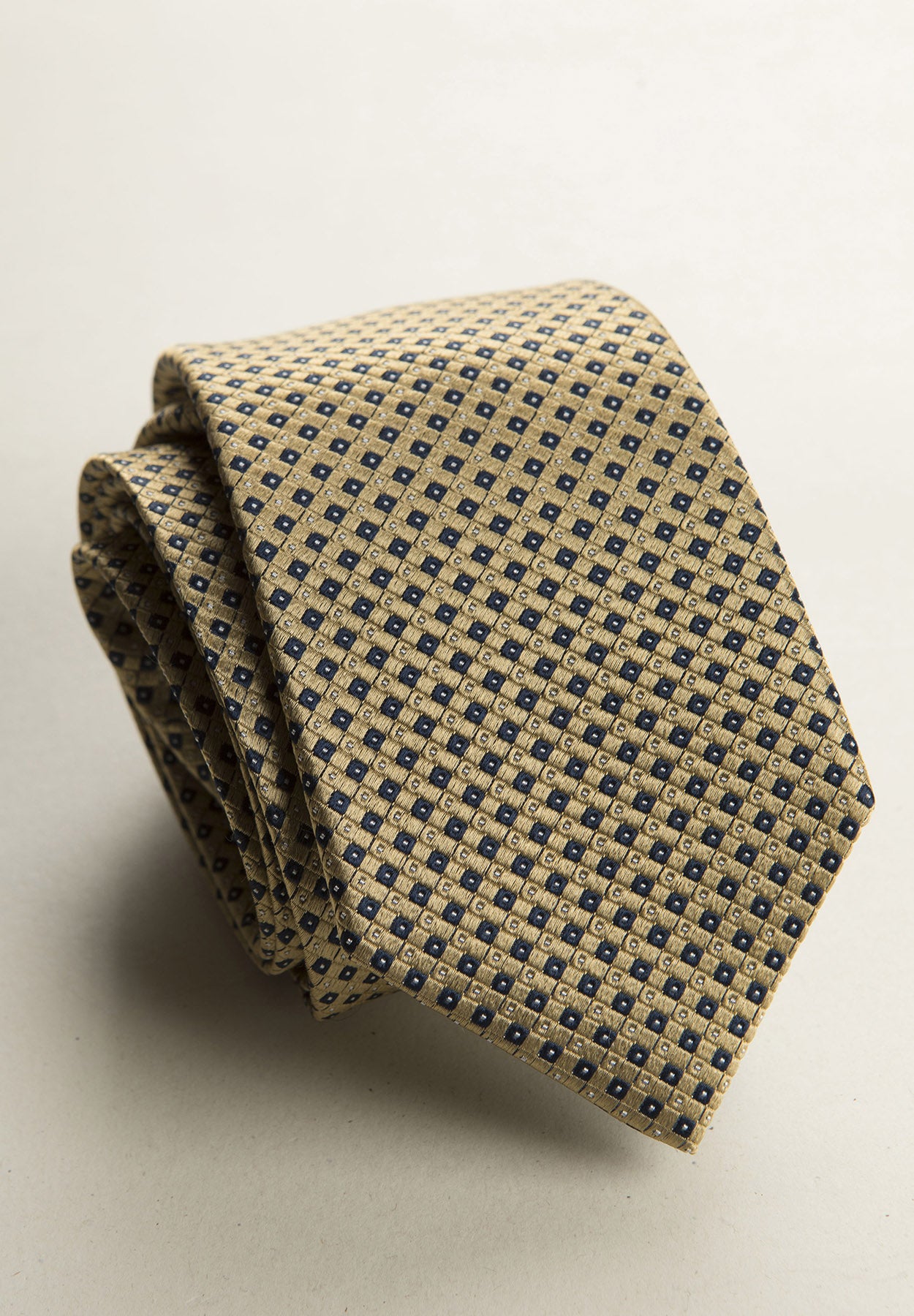 Ochre tie with blue micro design silk