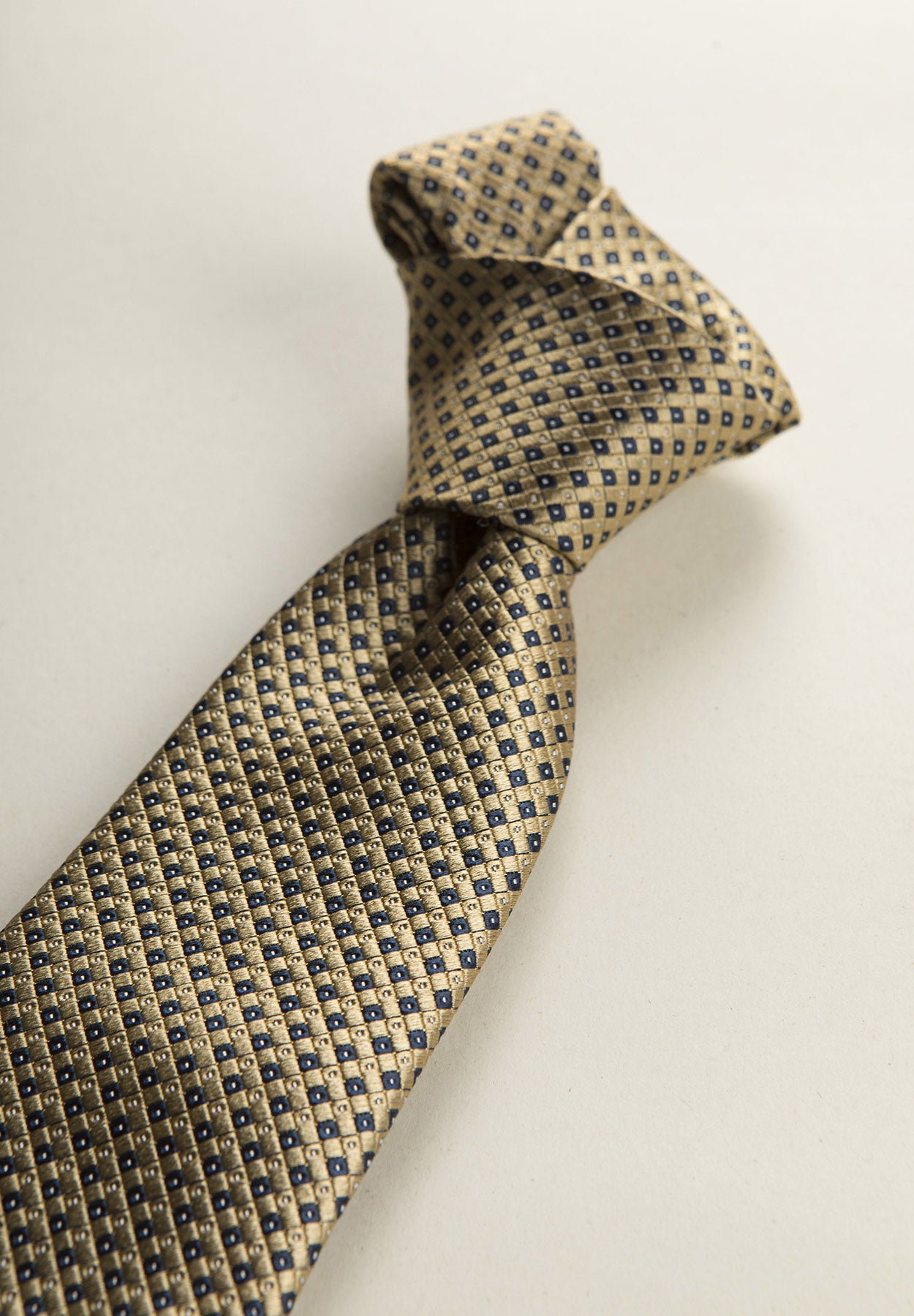 Ochre tie with blue micro design silk