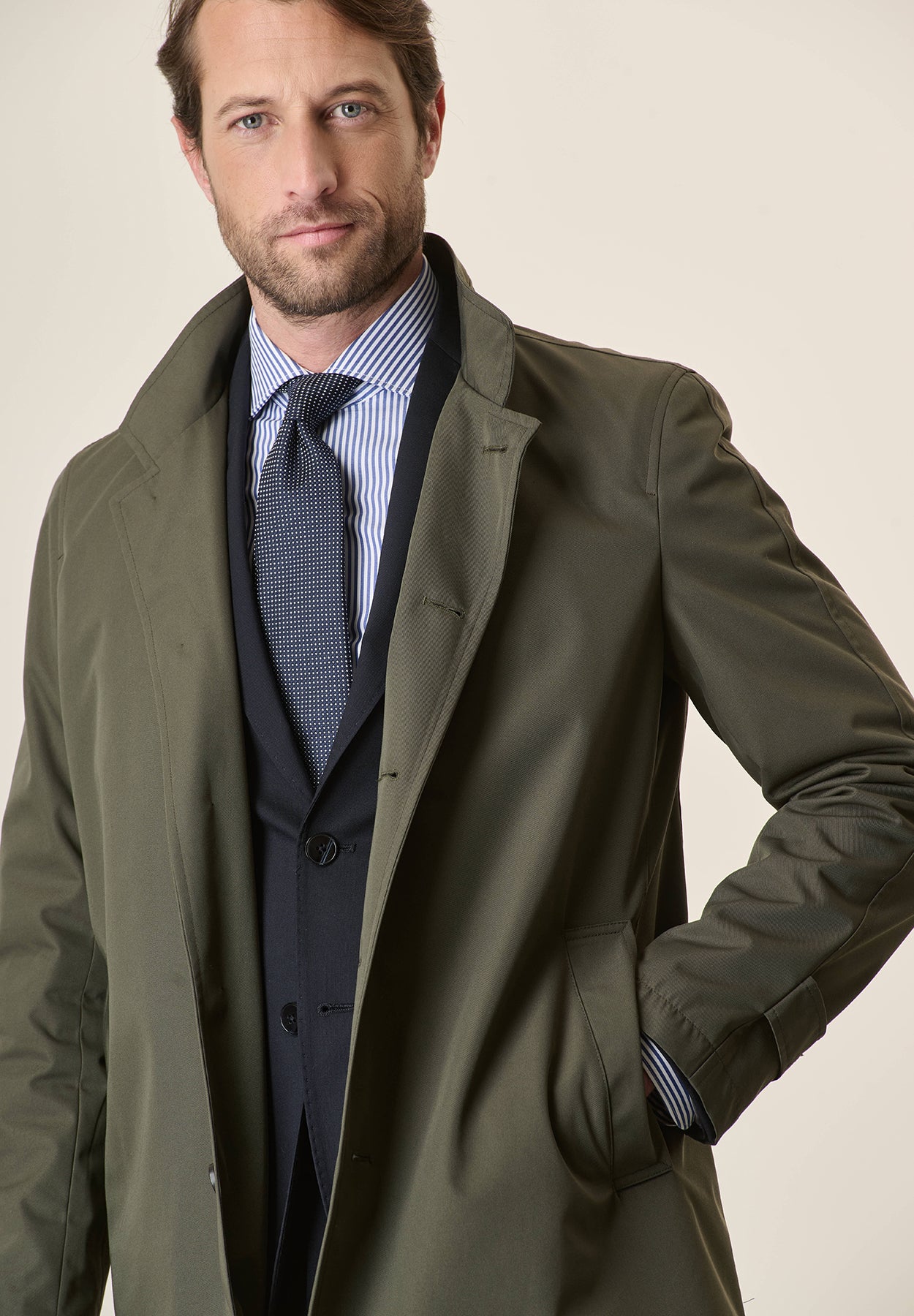 Green raincoat with stand-up collar