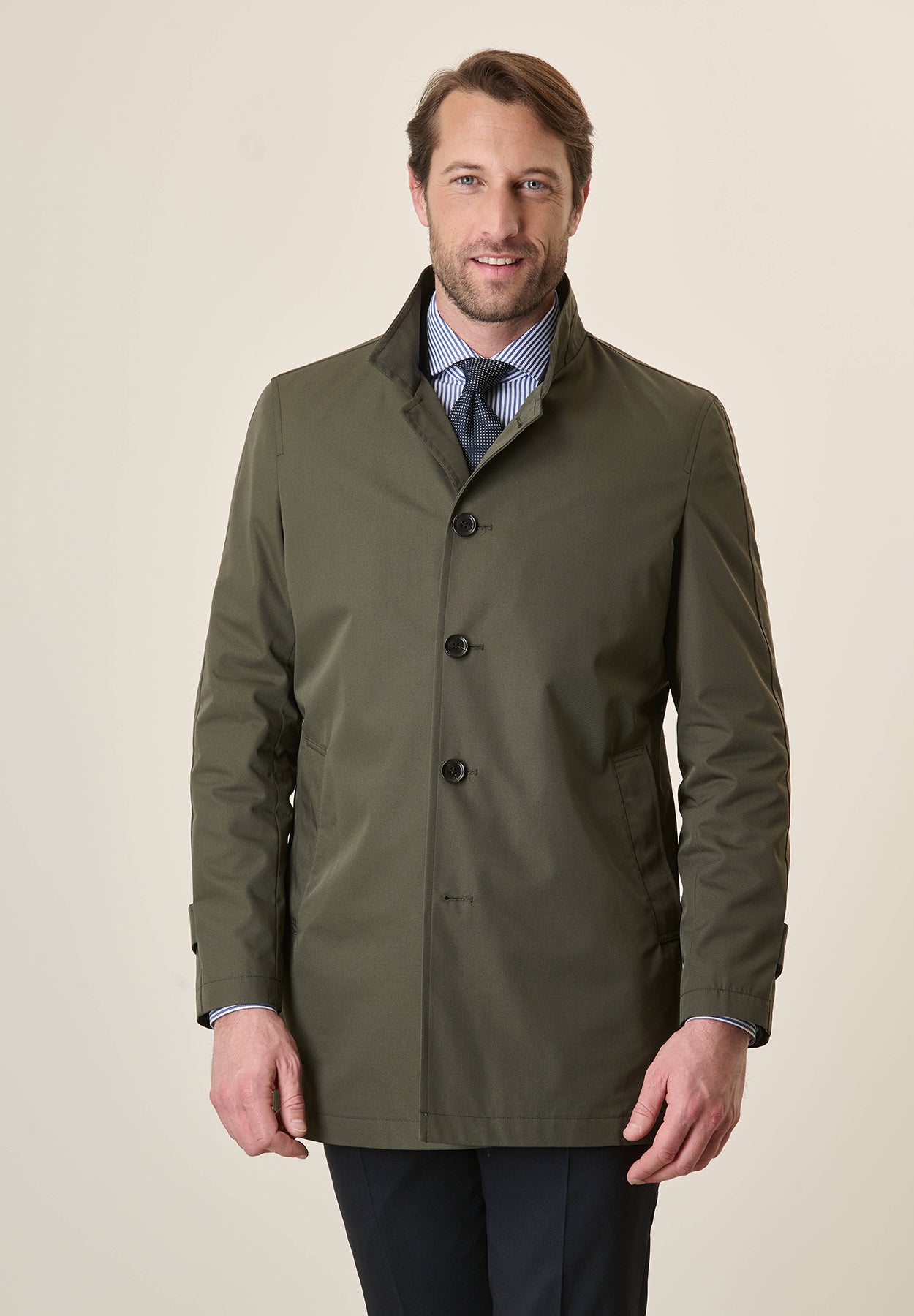 Green raincoat with stand-up collar