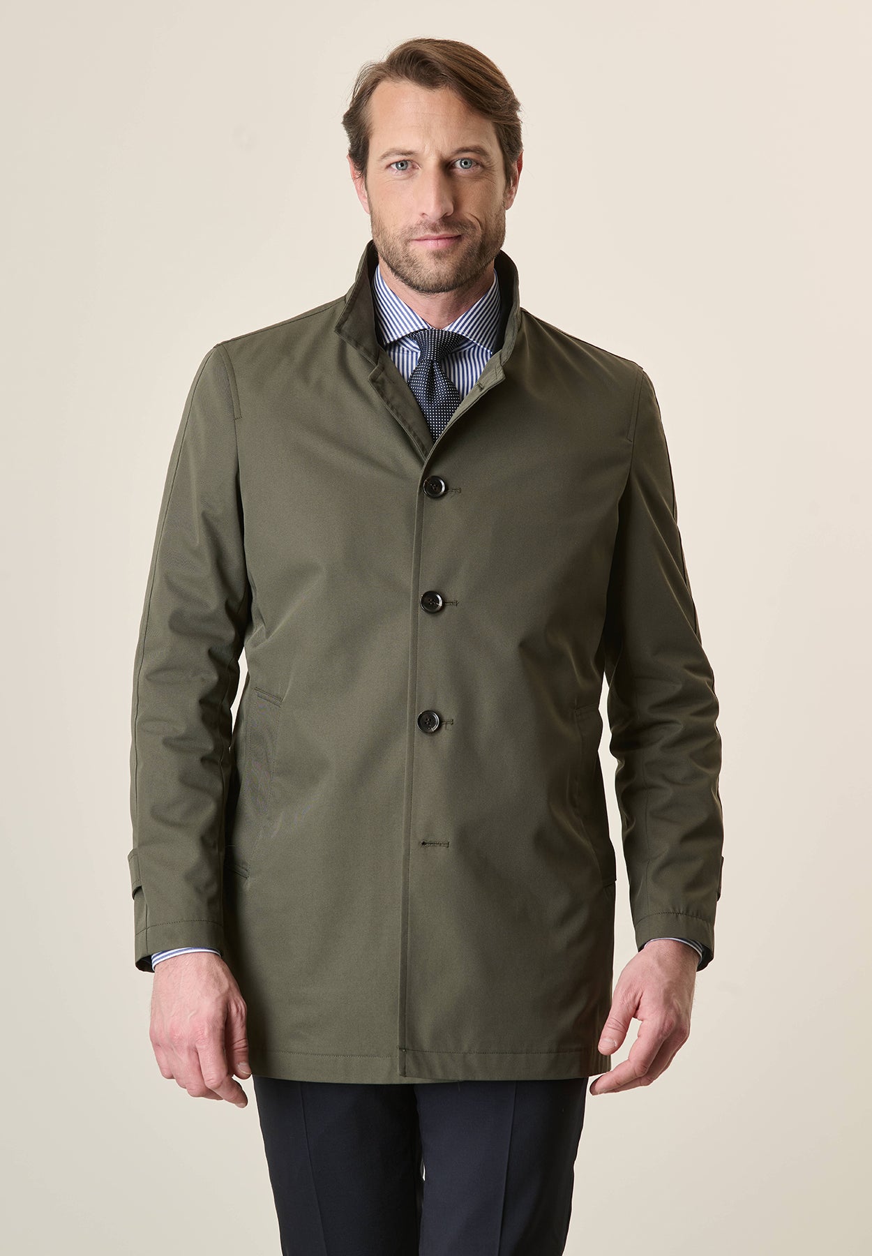 Green raincoat with stand-up collar