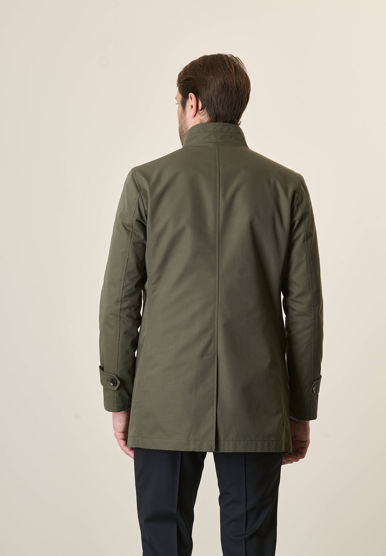 Green raincoat with stand-up collar