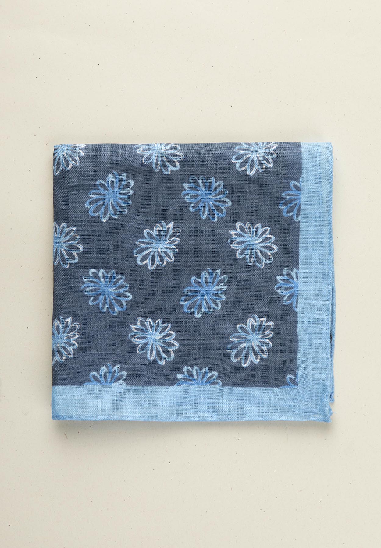 Blue clutch bag with light blue flowers and linen