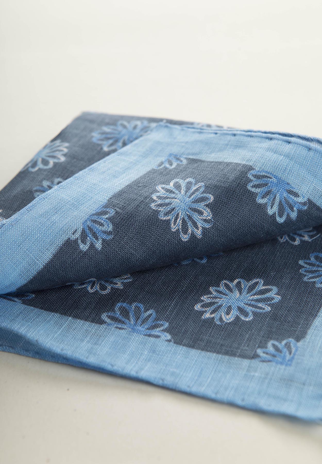 Blue clutch bag with light blue flowers and linen